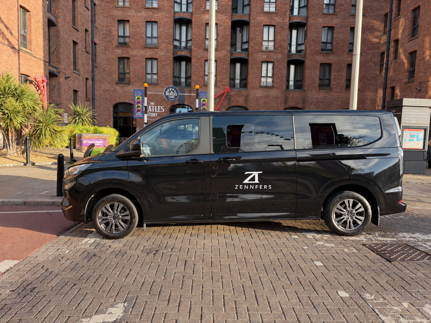Zennfers minibus in central Liverpool with its registration plate blanked