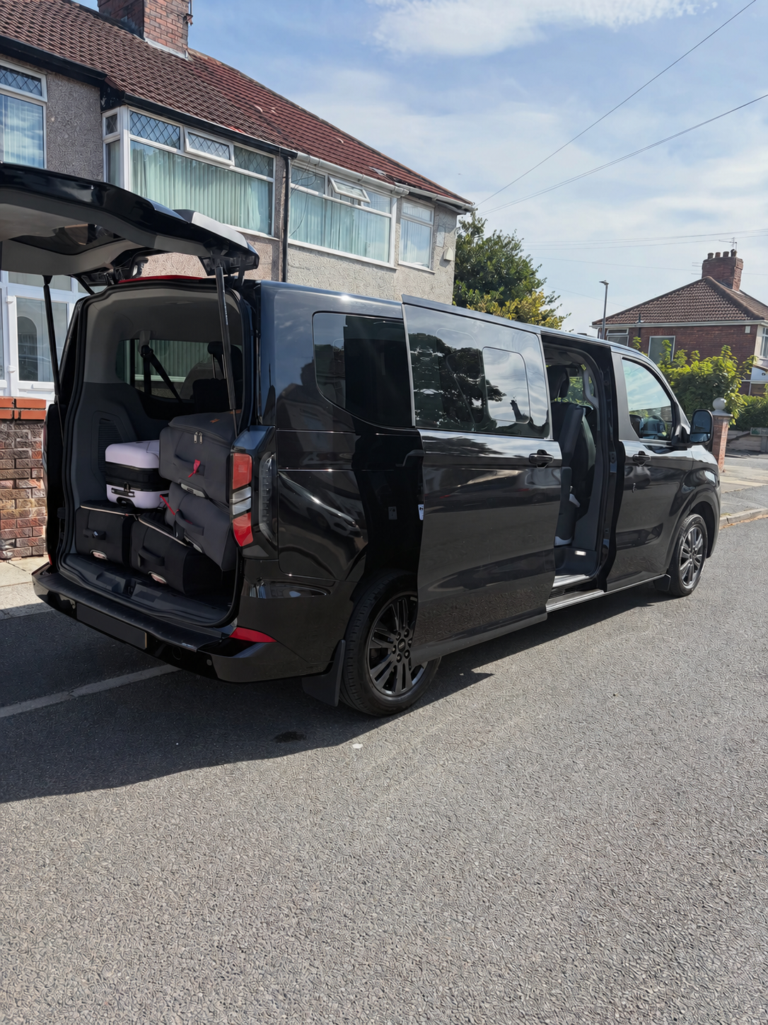 Zennfers minibus ready for group passengers with its registration plate blanked